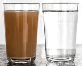 The glass on the left contains dirty water straight from a pond. The glass on the right contains water from the same pond, after it was purified in a Berkey system. Pond water, dirty and purified in Berkey system