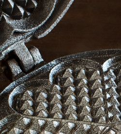 Detail of cast iron stovetop waffle maker